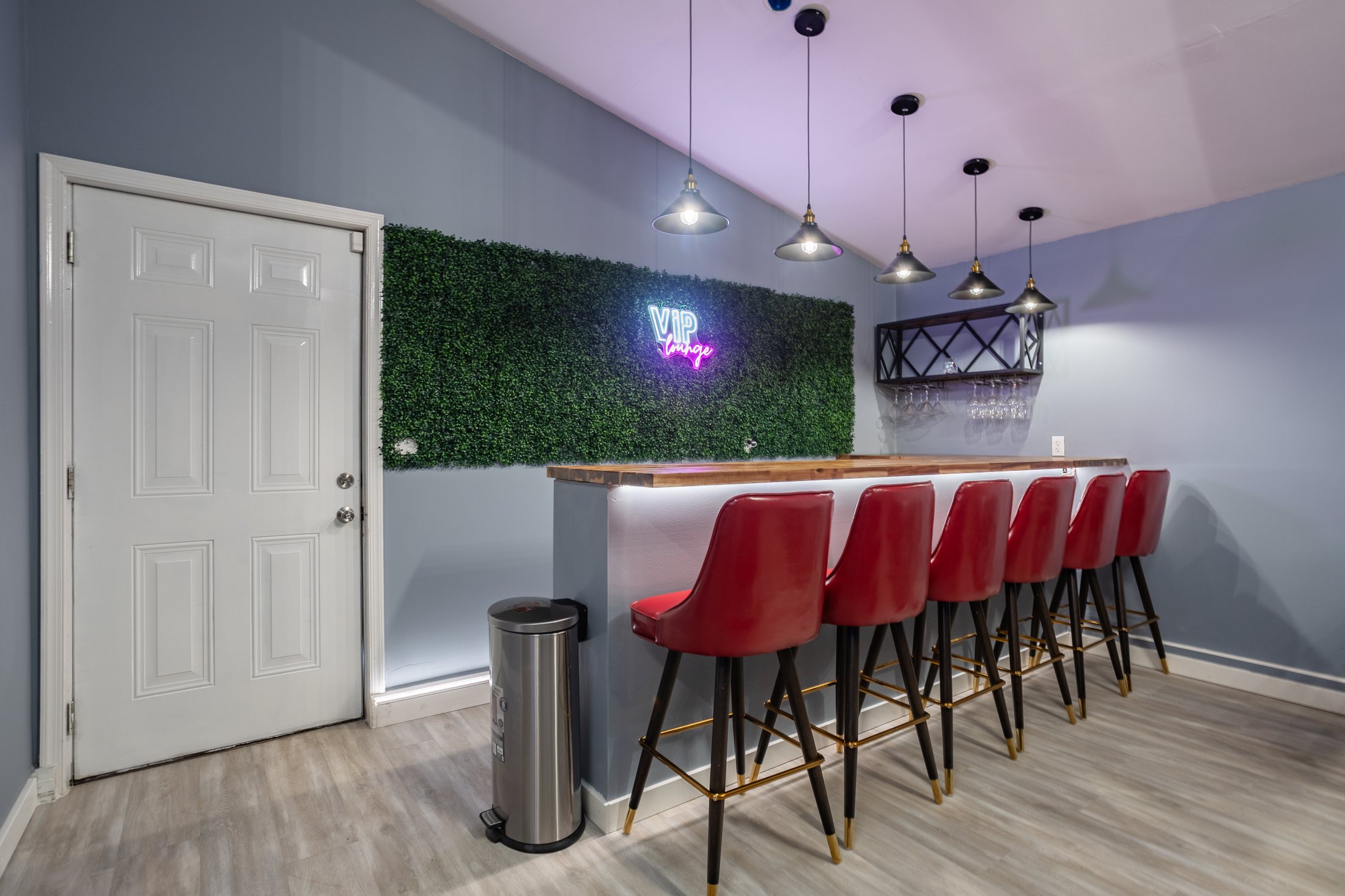 VIP lounge bar wall at Aurora Abodes